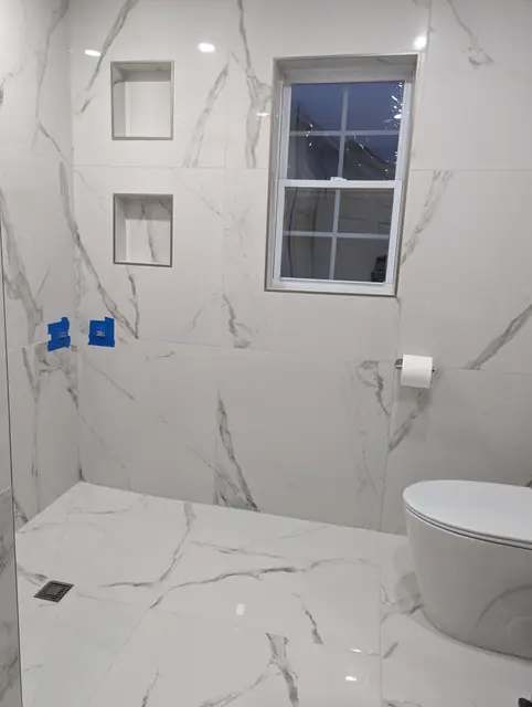 Marble-Look Hall Bathroom — 3 of 10